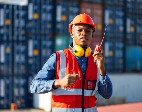 Container,Black,Man,Worker,Talking,On,Walkie-talkie,To,Colleague,Control Container,Black,Man,Worker,Talking,On,Walkie-talkie,To,Colleague,Control